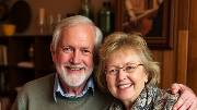 Tom and Jan, mid-forties, enjoy a modern indoor setting without retro vibes.